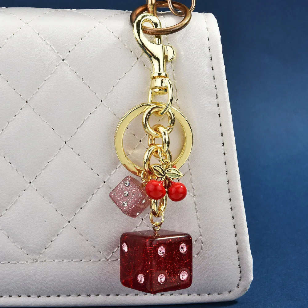 Vintage cherry red two-tone metal dice bag keychain pendant with a square geometric shape