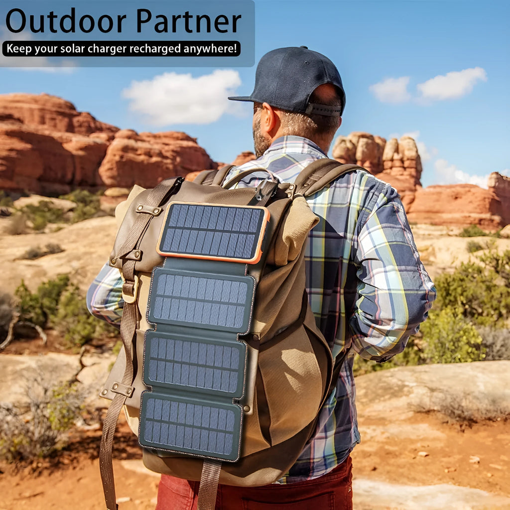 Outdoor solar power bank in black with a solar panel, soft leather finish, and LED light on a grassy field.