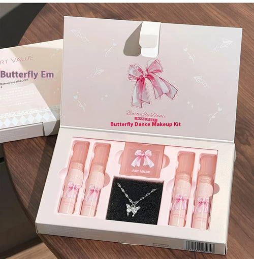 Butterfly Box Suite makeup set showing four matte lip muds, powder blusher, and coordinating necklace