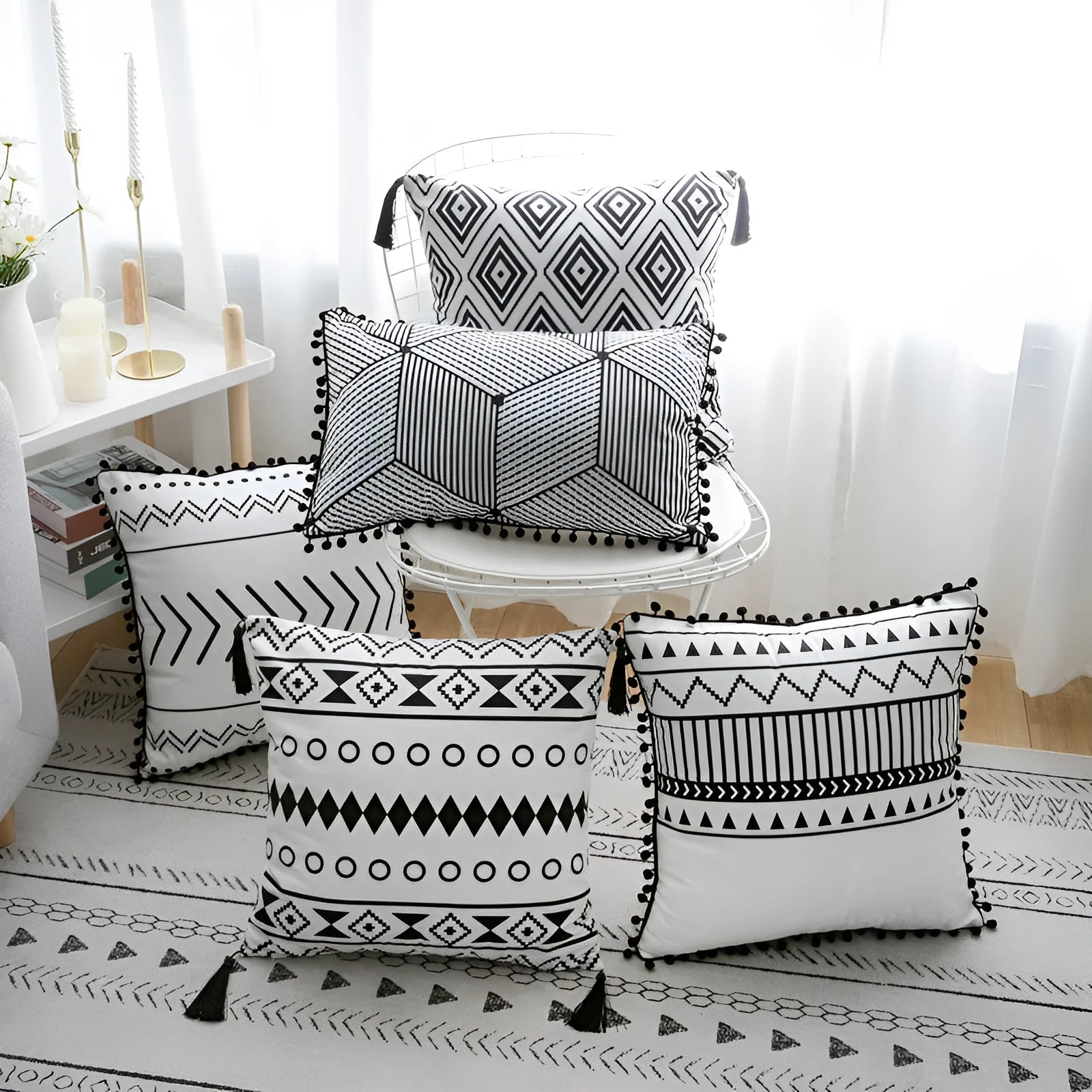 Bohemian style decorative throw pillow with polyester cover in light grey on a sofa.