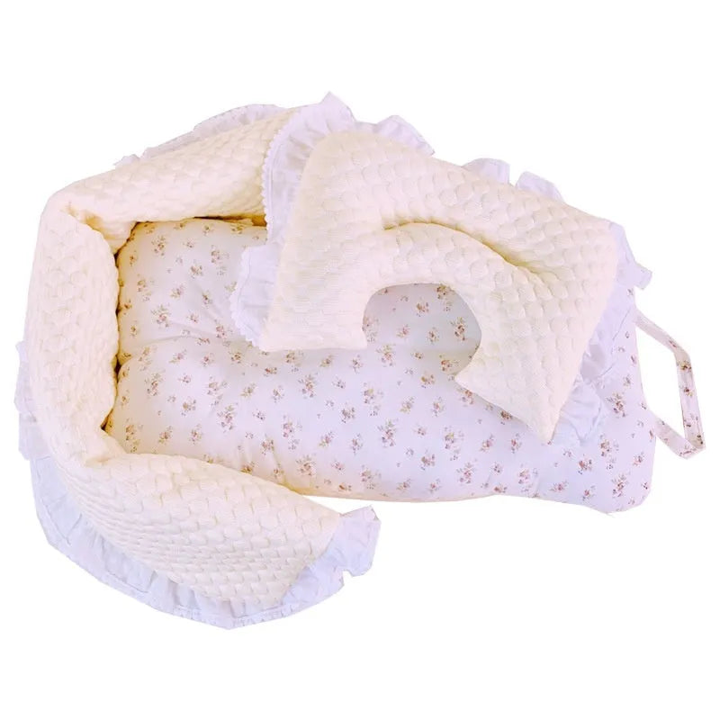 A green grey striped towel, cushion, and pillow set for a pet stroller, shown removed and ready for washing.