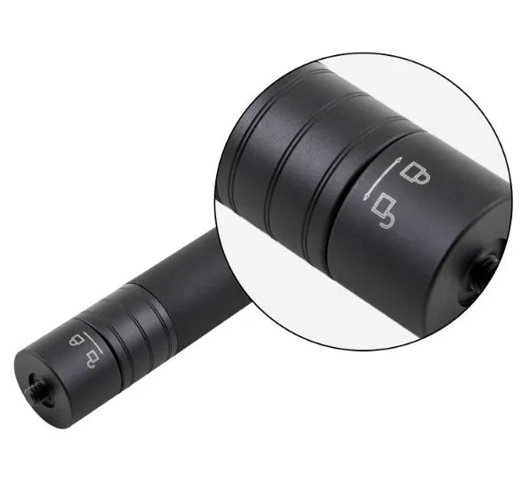 Black retractable selfie stick with extended aluminium pole and Bluetooth remote, holding a smartphone.