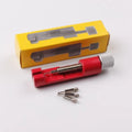 Watch strap link remover tool in black with two thimbles and a metal watch band placed on the detacher groove