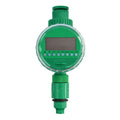 Green plastic automatic watering timer with digital display for garden hose connection.
