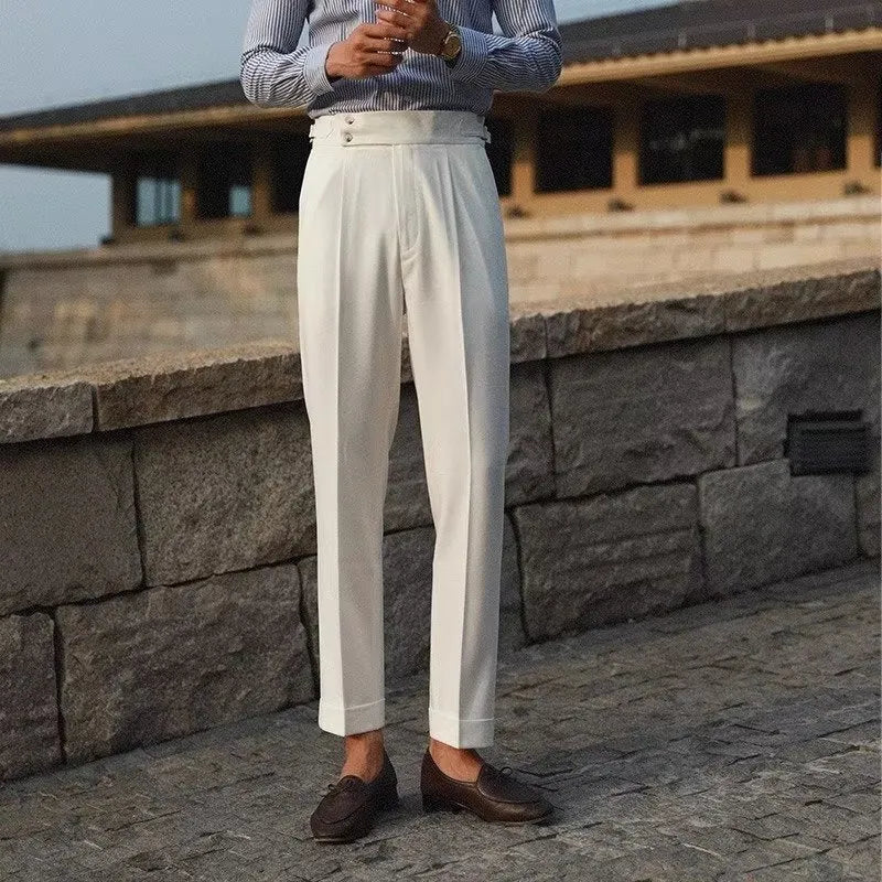 Men's slim fit straight leg suit trousers in black, white, or apricot colour on a hanger.
