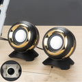 Compact black and gold USB-powered stereo desktop speakers for laptop and computer.