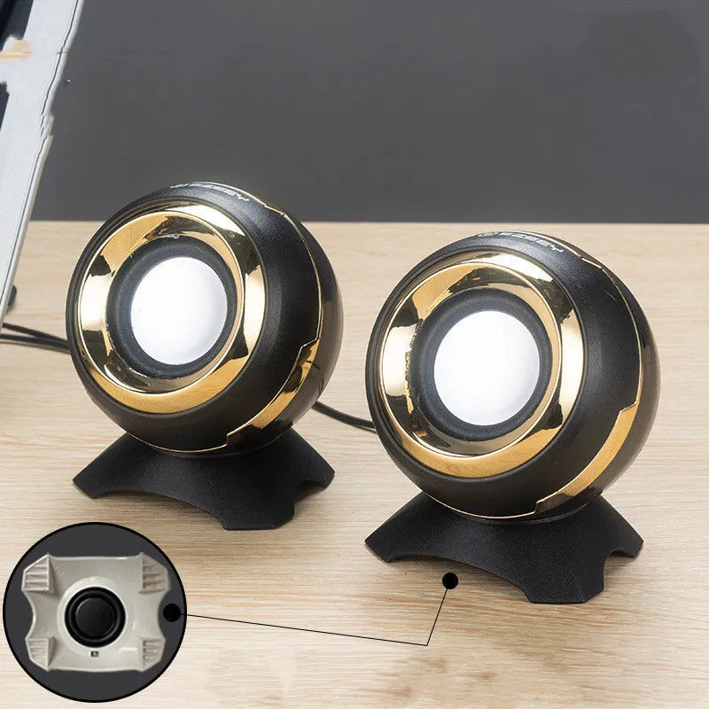 Compact black and gold USB-powered stereo desktop speakers for laptop and computer.