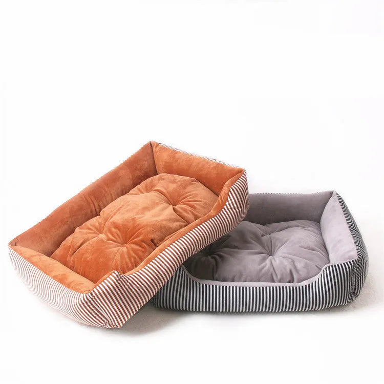 A grey and white striped bolster-sided pet bed for dogs or cats with a removable cloth cover.
