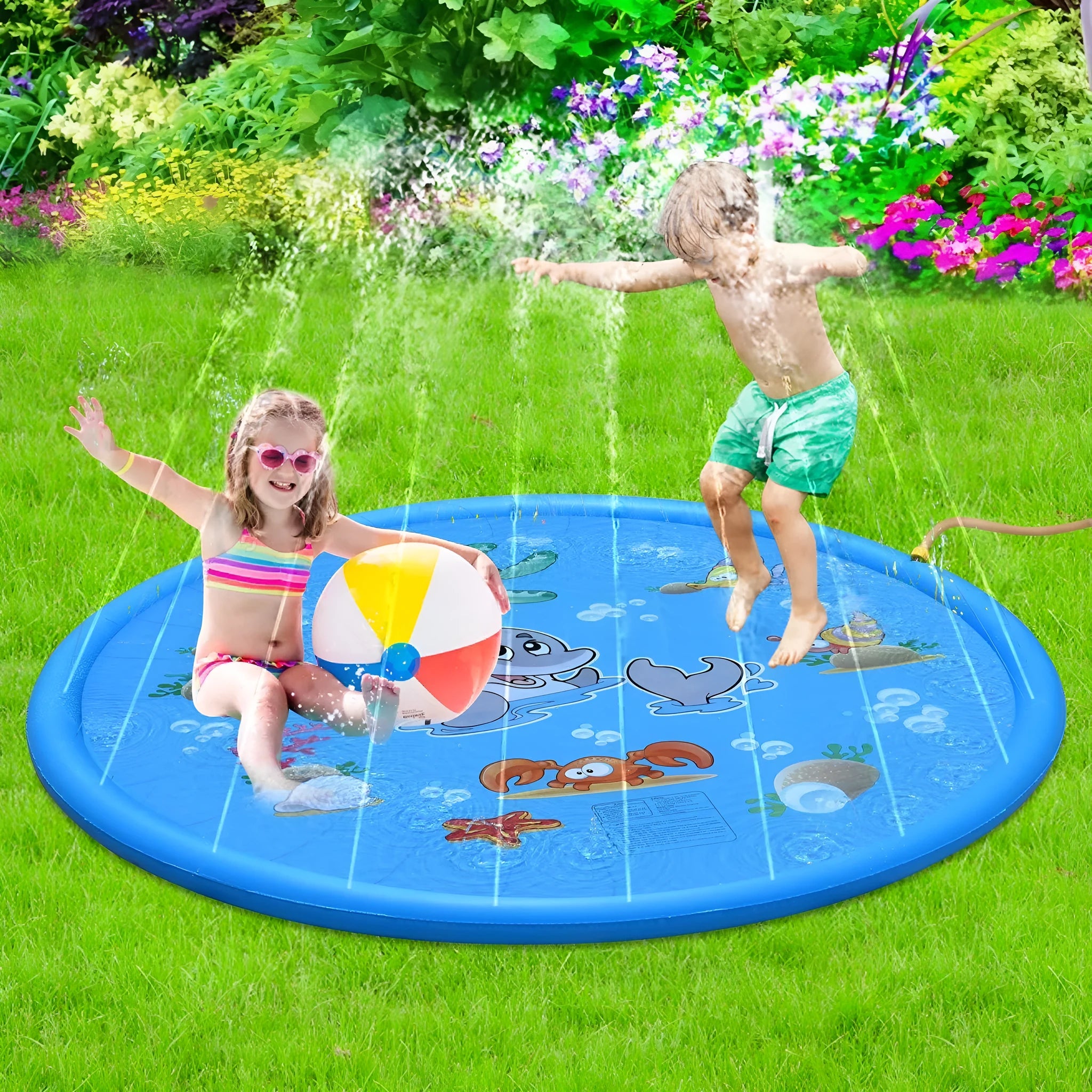 Blue children's water spray play mat with marine animal graphics on grass connected to a hose
