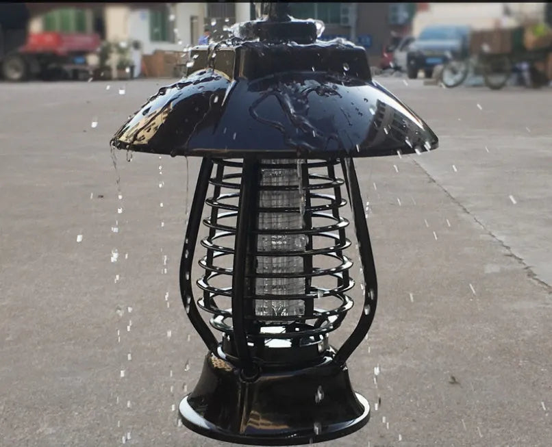 White and black solar-powered outdoor mosquito lamp with solar panel on top and LED light body.