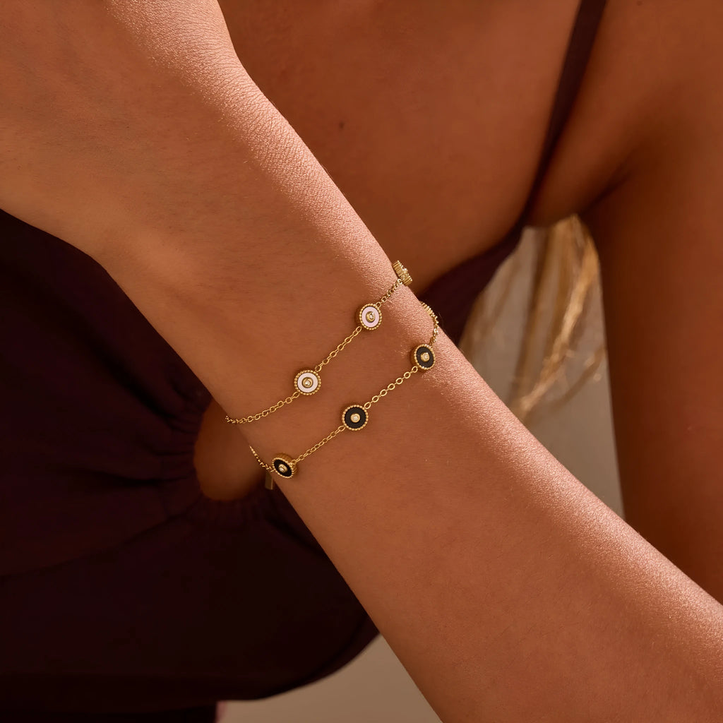 Gold-plated geometric fritillary design stainless steel bracelet and necklace set for women.