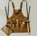 Yellow coated canvas leather webbing apron with adjustable straps for men and women, suitable for workshop and DIY tasks.