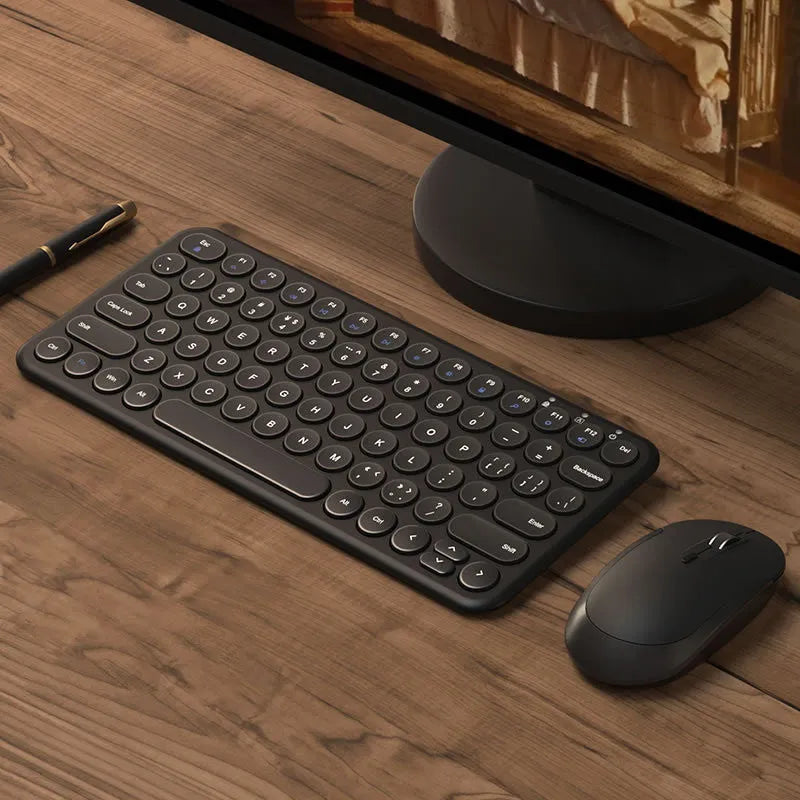 Mute white ultra-thin wireless keyboard and mouse with tiny USB receiver on a wooden desk