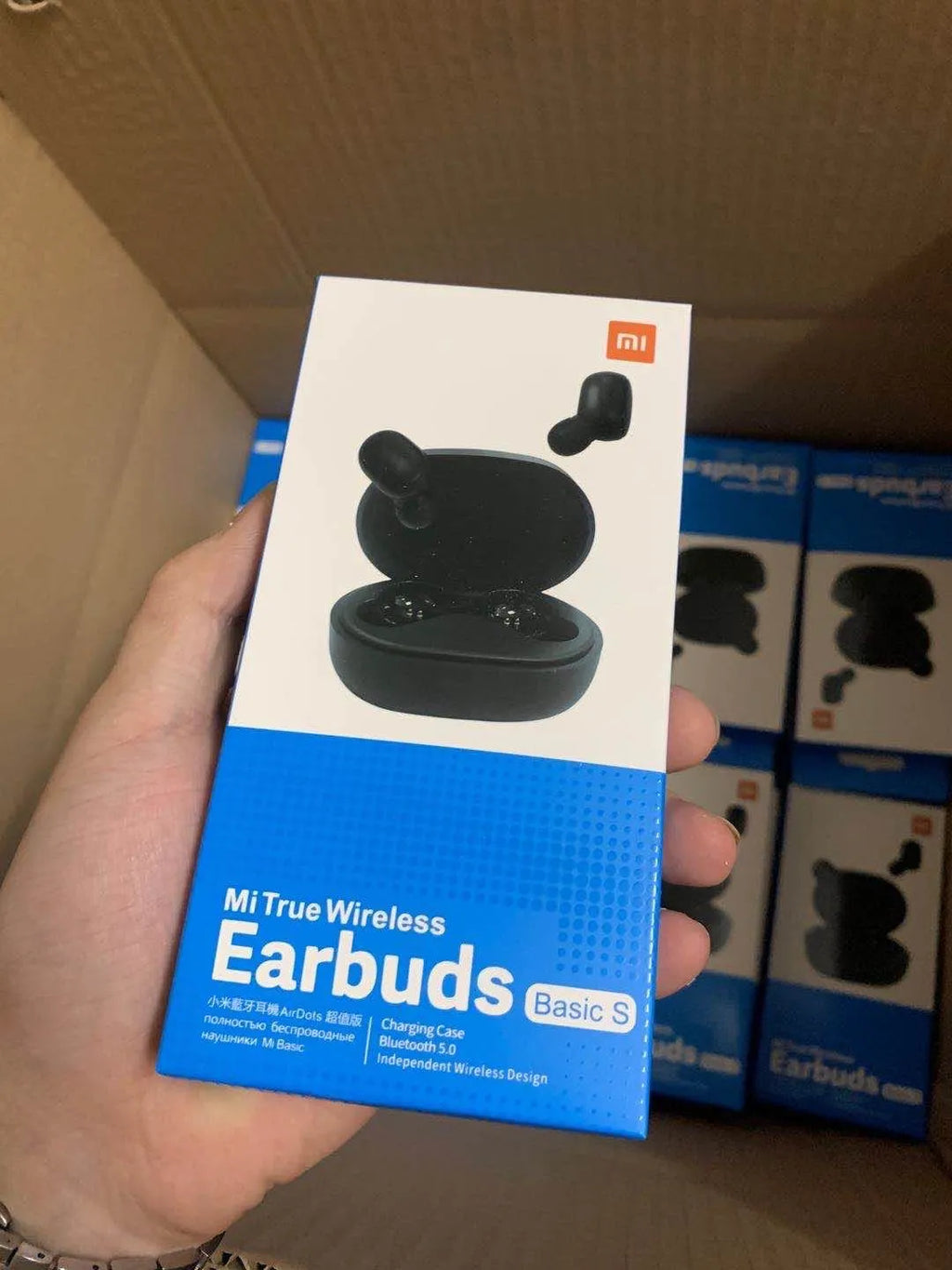 Black Redmi AirDots true wireless Bluetooth earbuds with a charging case.