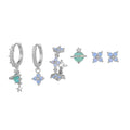 Gold and silver floral ear studs with blue zircon flower nail detail in Japanese Korean style