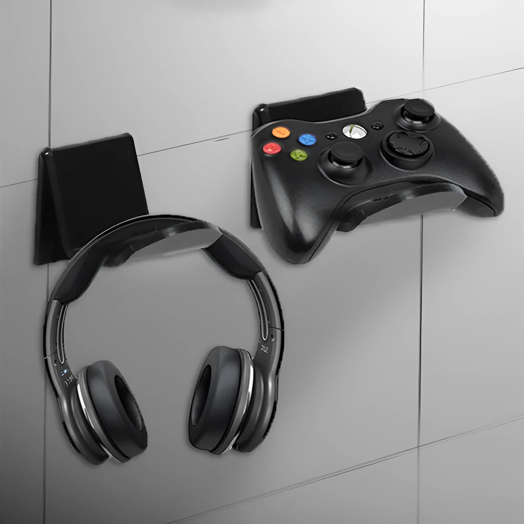 Universal black game controller wall bracket mounted on a wall holding a PlayStation controller.