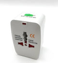 Compact white universal travel adapter plug for international power socket conversion.