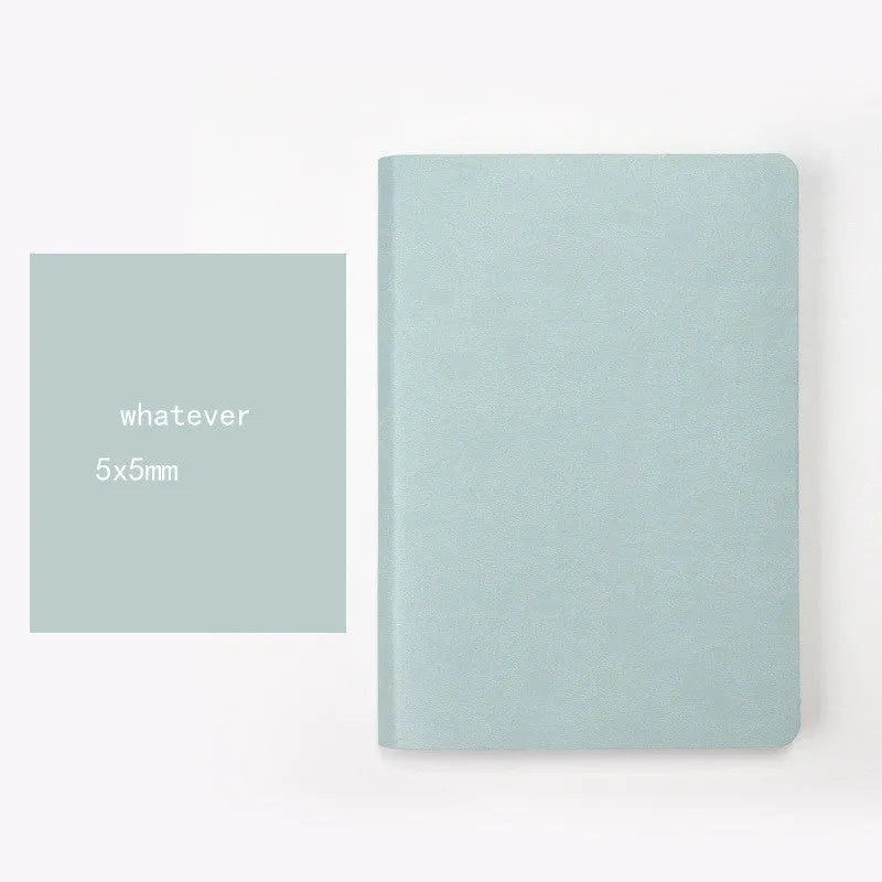 Blue and pink soft touch A5 dotted notebooks showing dot grid pages and imitation leather cover.