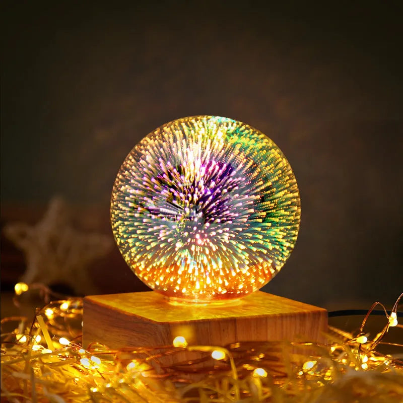 USB plug-in crystal ball LED night light showing fireworks design on a desk