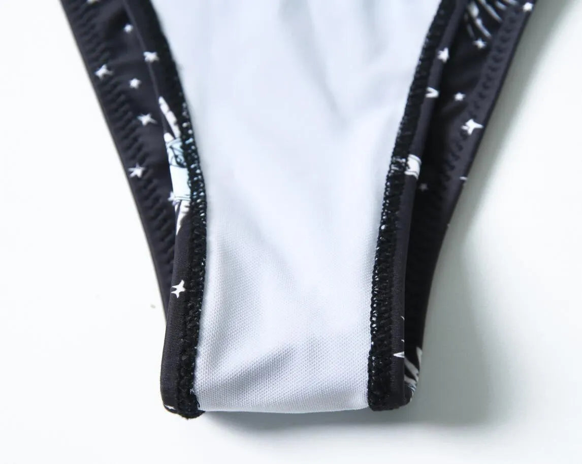 Black one-piece swimsuit with split tube top and backless design for swimming