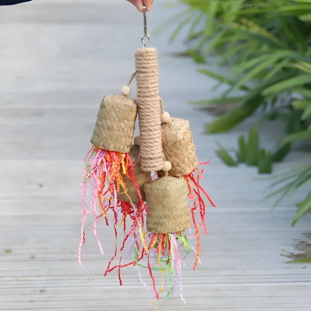 Parrot foraging toy made of wood and sisal rope with colourful shredded paper inserts