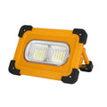 Yellow outdoor portable solar LED light with power bank and magnetic base, 36LED lamp beads model 5730, sitting on a metal surface
