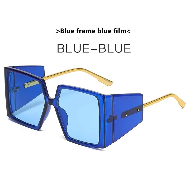Large square frame sunglasses with UV400 lenses in seven colour options on a wooden surface.
