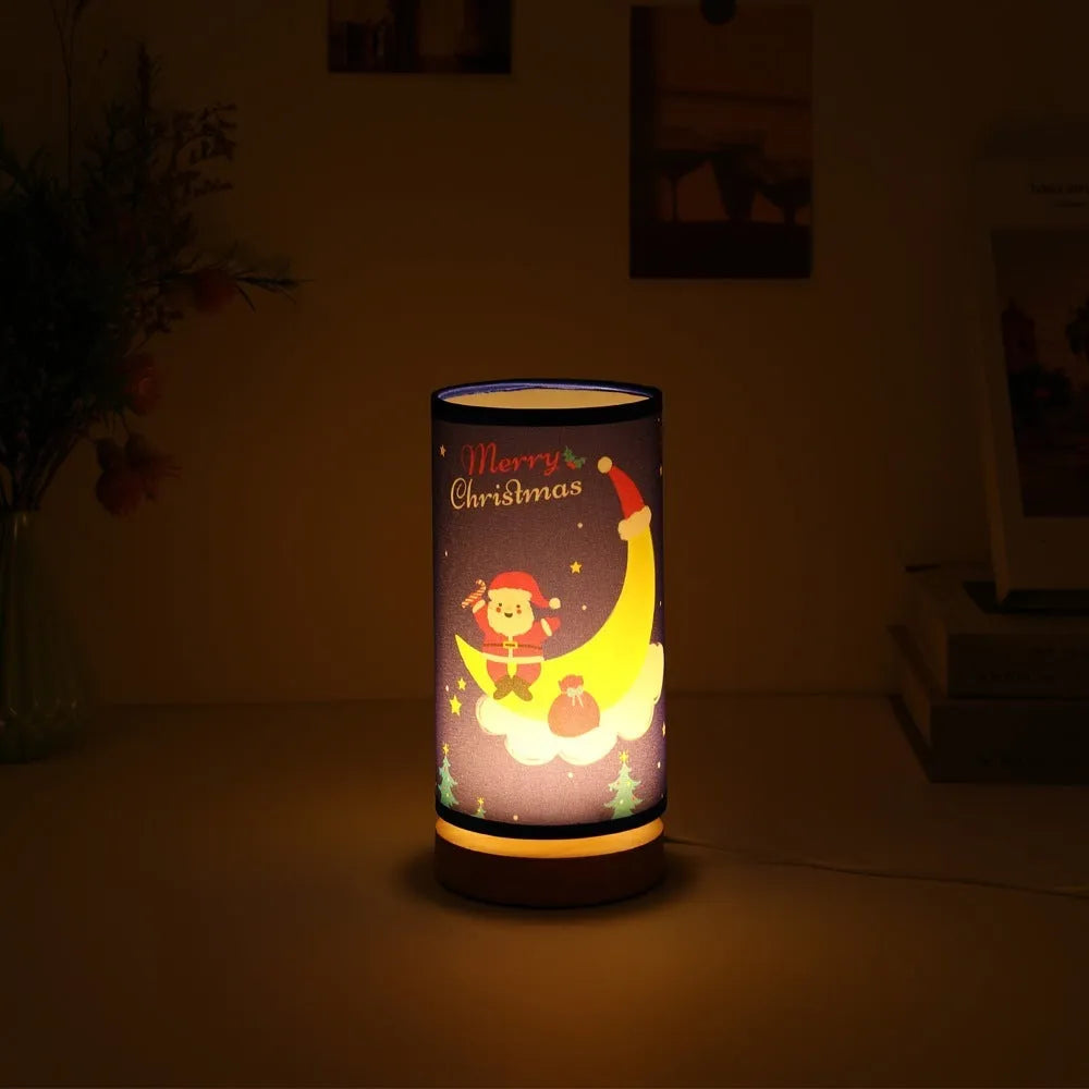 Moon and Santa Claus themed LED night light with a bamboo base and USB plug cable.