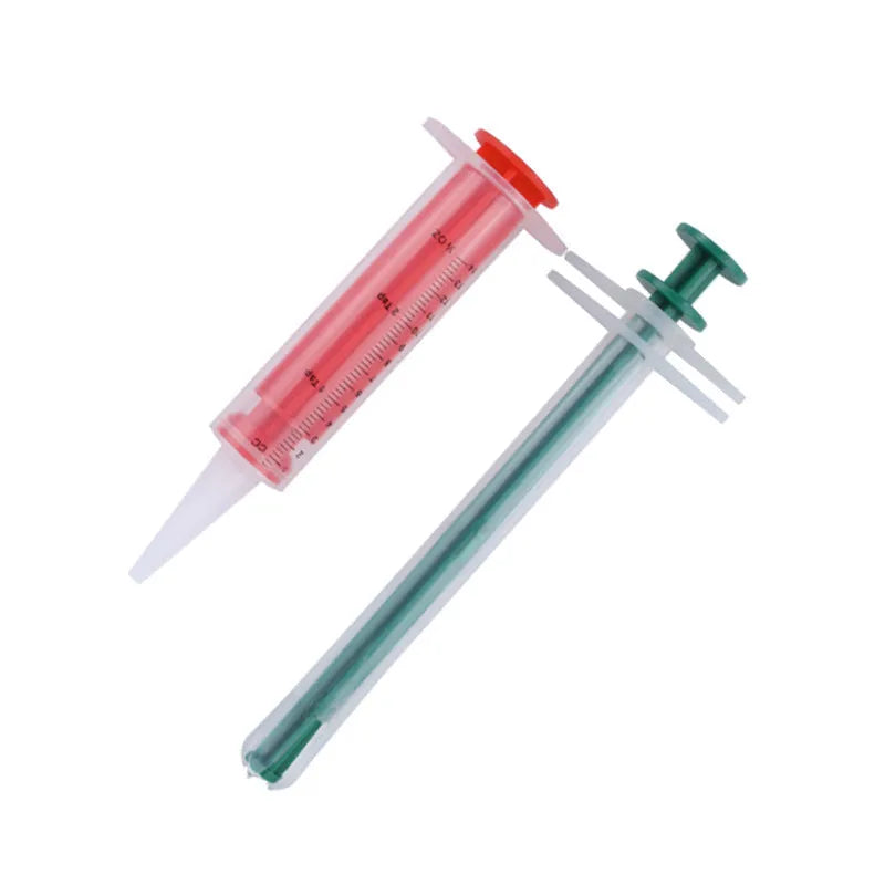 Two silicone pet pill shooters with soft tips for medication administration