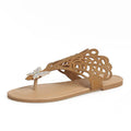 Women's black slip-on sandals with rhinestone decoration and an open flip-toe design on a flat rubber sole.