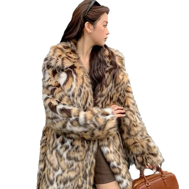 Street fashion faux fur coat with fur collar in mid-length style showing pocket detail