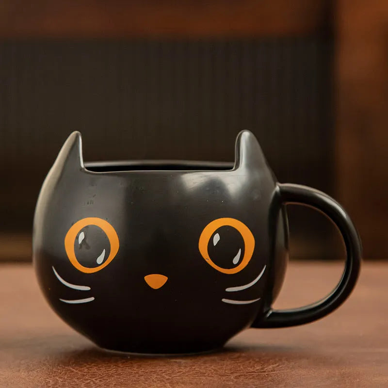 Black cat-shaped ceramic mug with pumpkin decoration and 355ml capacity