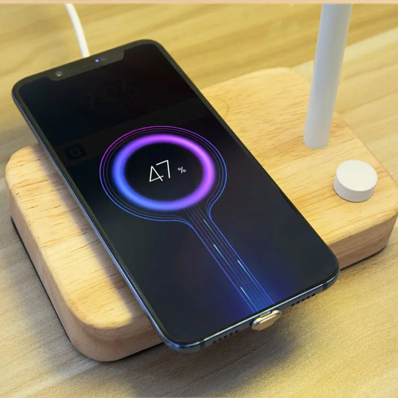 Bamboo Nordic desk lamp with touch switch and wireless charging pad in white finish on a bedside table