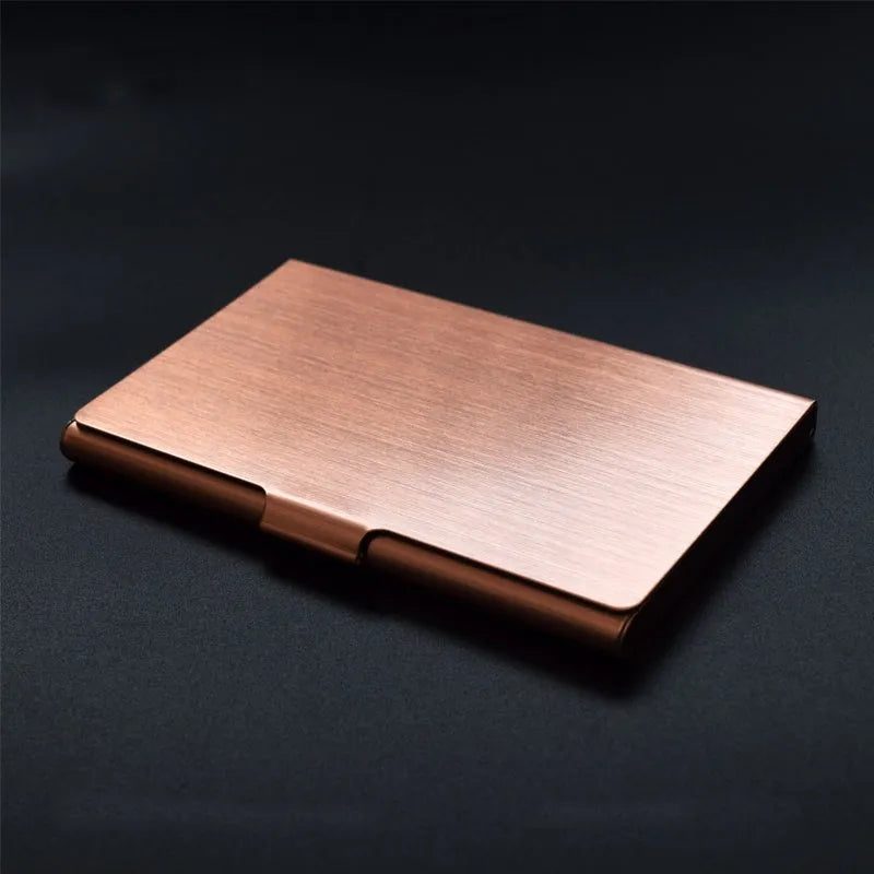 Metal titanium business card holder in black finish holding business cards