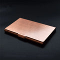Metal titanium business card holder in black finish holding business cards