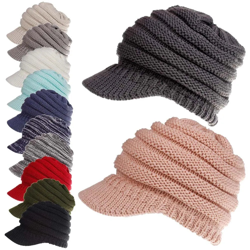 Acrylic knitted ponytail beanie hat for women in a neutral colour, shown on a model with a high ponytail.