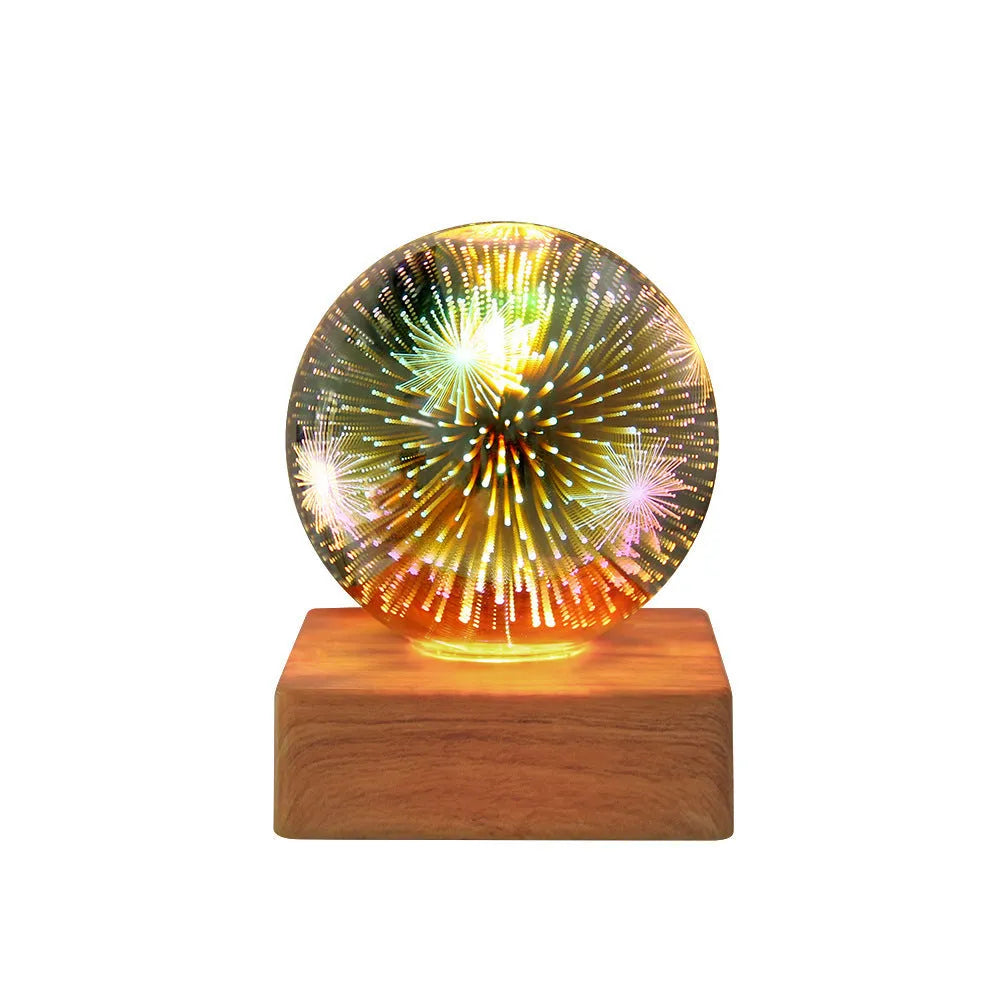 USB plug-in crystal ball LED night light showing fireworks design on a desk