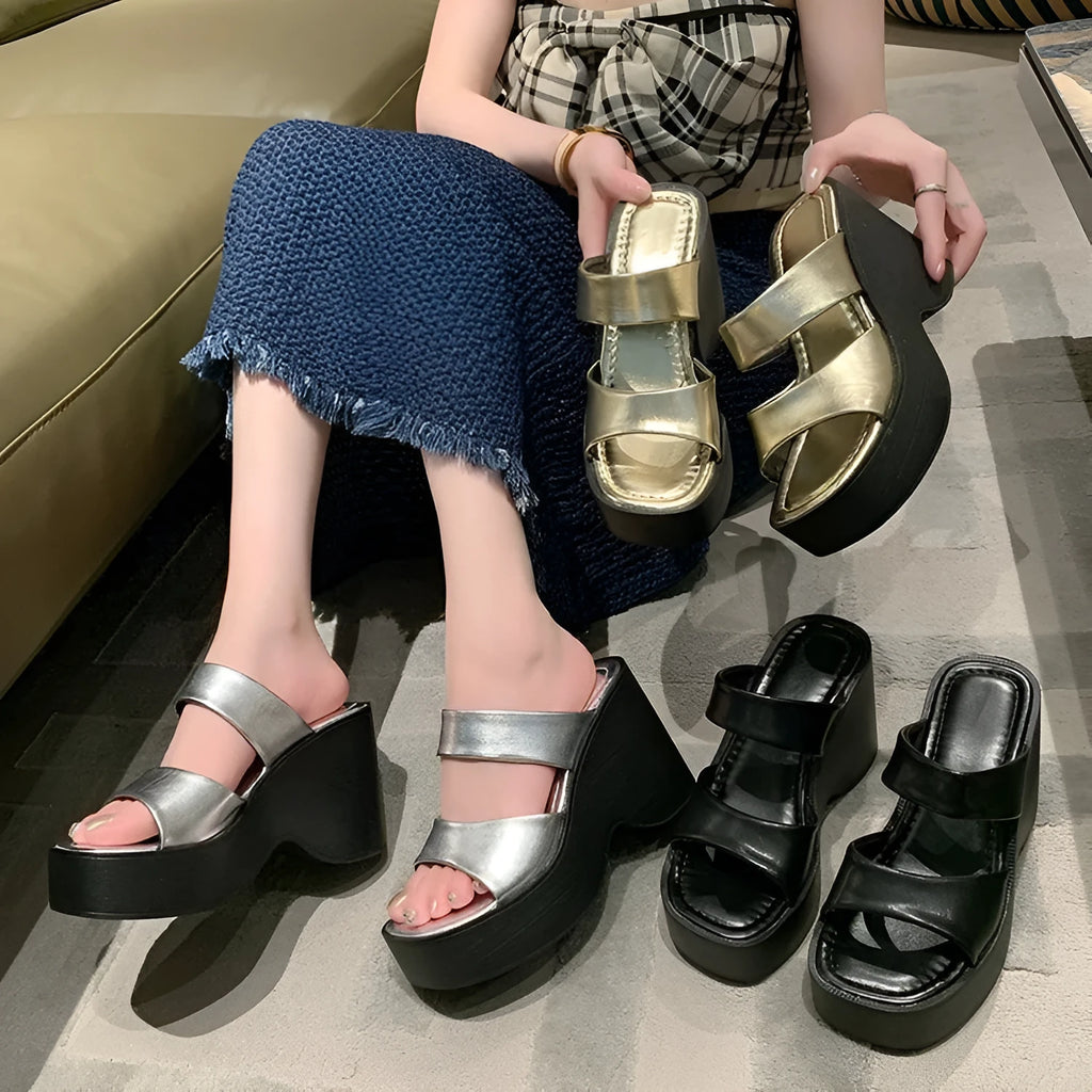 Women's black wedge platform slippers with a square toe and PU upper material.