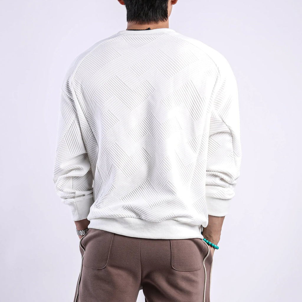 Men's loose fit solid colour twill jacquard pullover sweater on a hanger.