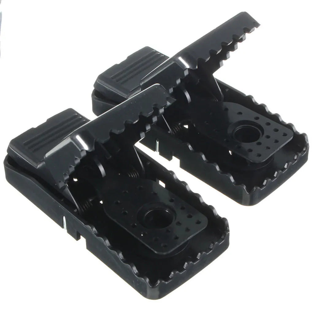 Six black plastic snapping mousetraps with dimensions 11cm long by 5cm wide