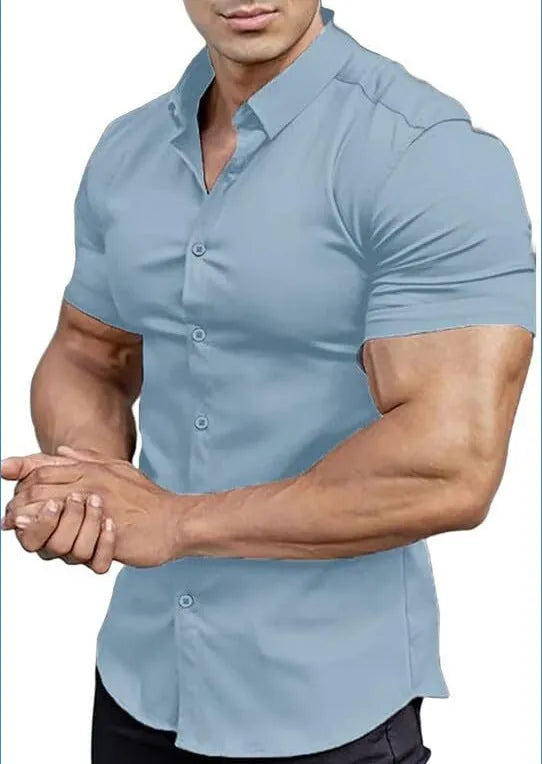 Man wearing a brown short sleeve printed casual shirt with a collar.