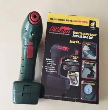 Black portable car tyre inflator with digital display and LED light on a coiled power cable.