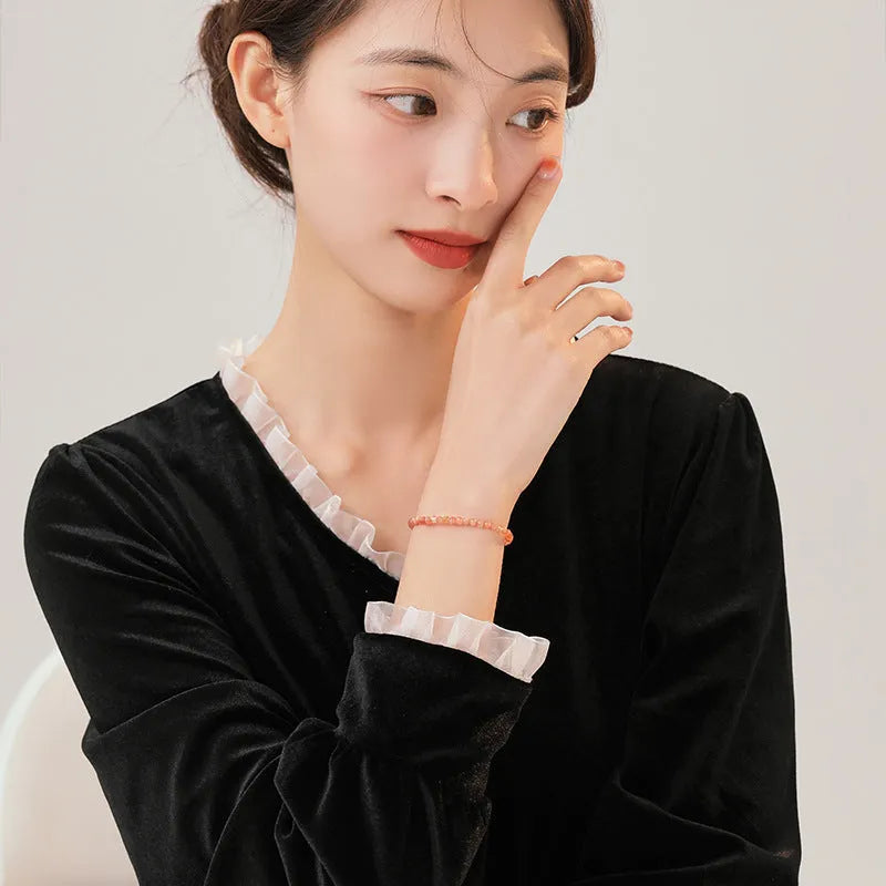 Ultra-thin 3mm sunstone crystal bracelet shown on wrist with natural colour variations