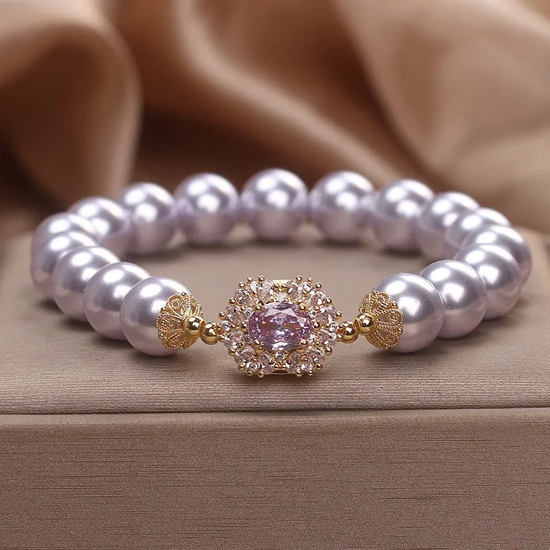 Dreamy purple zircon pearl bracelet with diamond flower charm on wrist