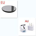 Black round desk cup warmer with tempered glass surface and low high switch on a wooden table.