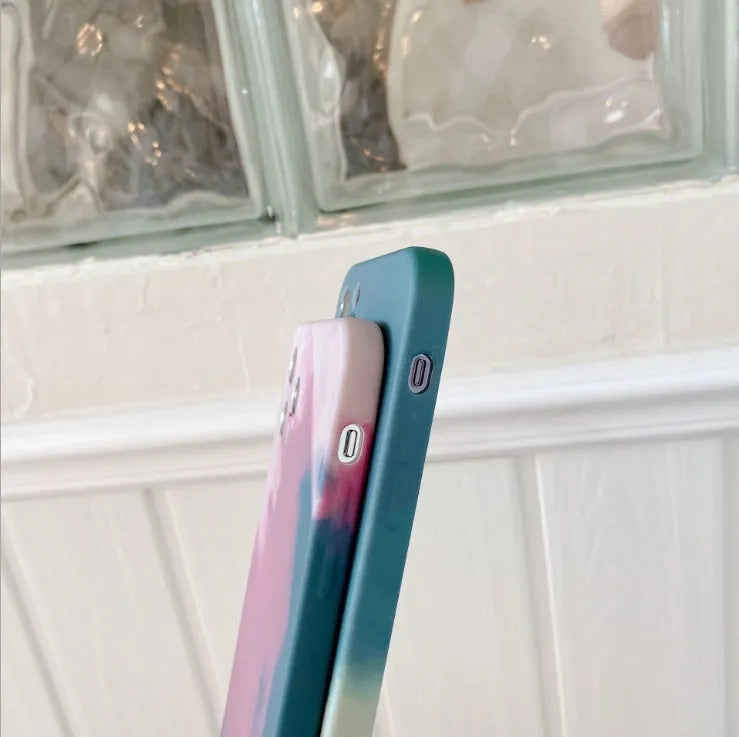 Soft silicone iPhone case with an oil painting gradient and abstract geometric pattern in purple.