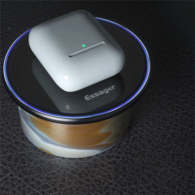 Black aluminium alloy 15W Qi fast wireless charging pad on a wooden desk