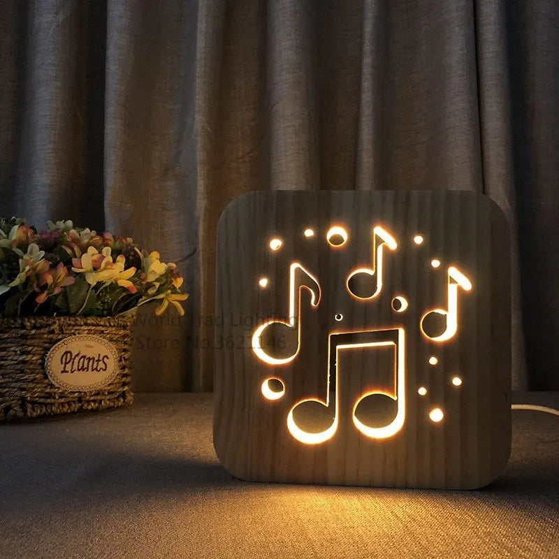 Square 3D wooden lattice USB lamp emitting warm white light on a desk, showing pine grain and USB cable.