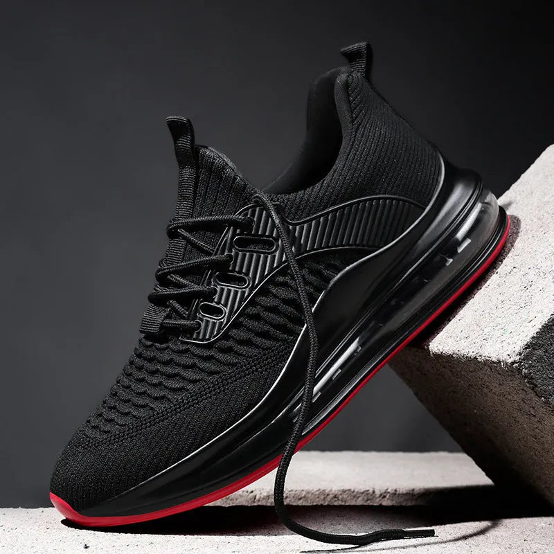 Men's black low-top mesh running shoes with a round toe and lace-up front on a white background.