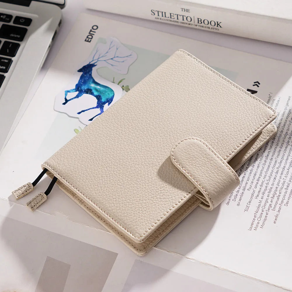 A6 loose-leaf diary with cowhide leather cover showing lychee pattern texture
